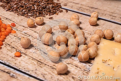 Chickpeas, lentils, and cheese are sources of protein in veganism and vegetarianism. Stock Photo