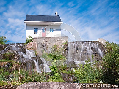 06/17/2018. Chicoutimi, Saguenay Quebec, Canada. The little house that stood up to a disastrous flood has become a symbol of perse Editorial Stock Photo
