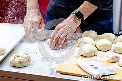 Chief baker prepares bun dough Stock Photo