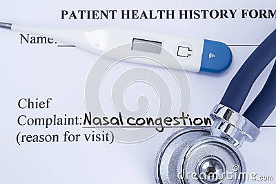 Chief complaint nasal congestion. Paper patient health history form, on which is written the complaint nasal congestion as the mai Stock Photo