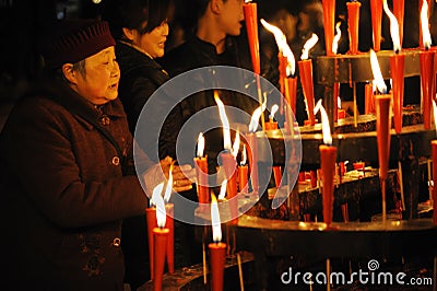 Chiense people burn incense for good luck. Editorial Stock Photo