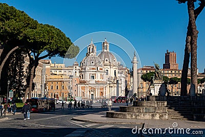 Chiesa Santa Maria di Loreto and Rome visitors passing by in a sunny winter day, Rome, Italy Editorial Stock Photo