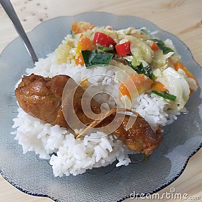 Chiken rice with vegetable dish Stock Photo