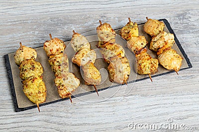 Chiken kebabs on wooden table Stock Photo