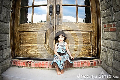 Child and antique door Stock Photo