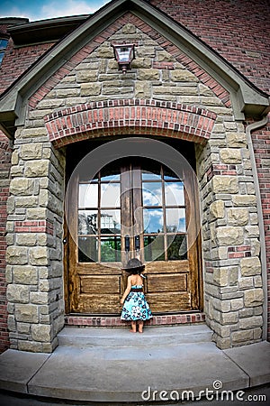 Child and antique door Stock Photo