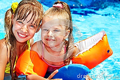 Child with armbands in swimming pool Stock Photo