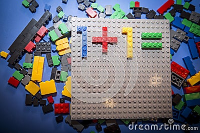 Child arranges block of constructor. a childhood game that develops the imagination of small people. Editorial Stock Photo