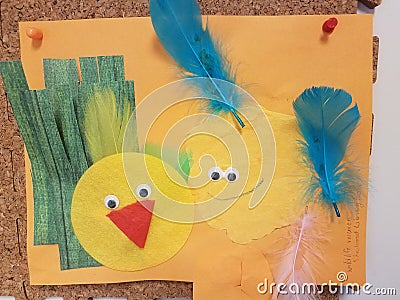 Child artwork of birds, yellow circles with feathers Stock Photo