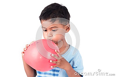 child asian little boy blowing balloon Stock Photo