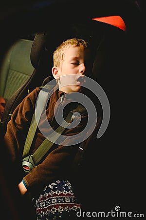 Child asleep in his extenuated car seat Stock Photo