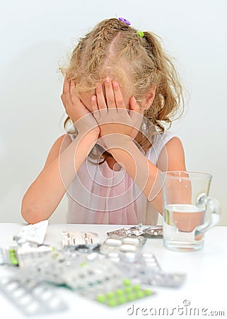 Child ate tablets. Stock Photo