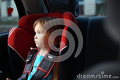 Child in auto baby seat in car Stock Photo