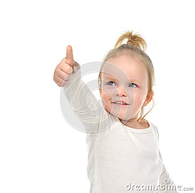 Child baby girl happy looking up smiling with hand thumb up sign Stock Photo