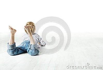 Child back lying down, looking forward Stock Photo