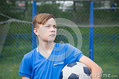 Child with ball playing football Stock Photo