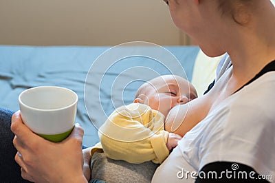 Child being nursed by the mother Stock Photo