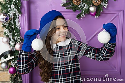 Child believe in miracle. Girl little kid hold decorations. Welcoming future year. Merry christmas and happy new year Stock Photo