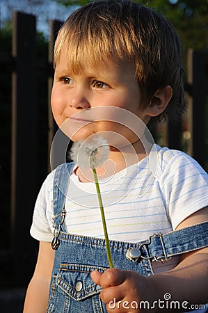 Child with blow-ball Stock Photo