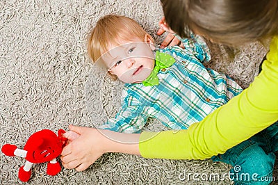 Child bow tie lies on the carpet Stock Photo