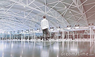 Child boy at the empty airport checkin waiting area Stock Photo