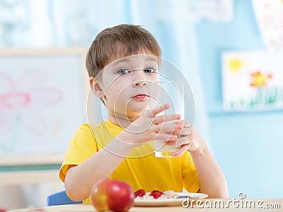 Child boy with a glass of fresh milk Stock Photo