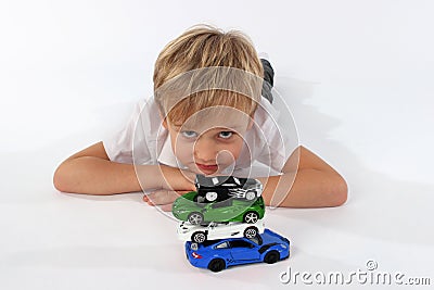 A child boy playing with car toys Stock Photo