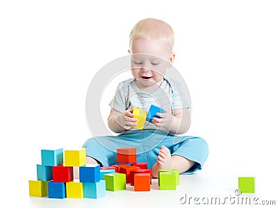 Child boy playing toy blocks isolated on white Stock Photo