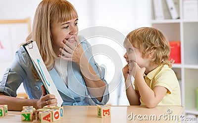 Child boy at speech therapist office Stock Photo