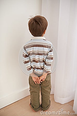 Child boy, trouble and time out for bad behaviour, discipline and parenting in family home. Punishment, small kid or son Stock Photo