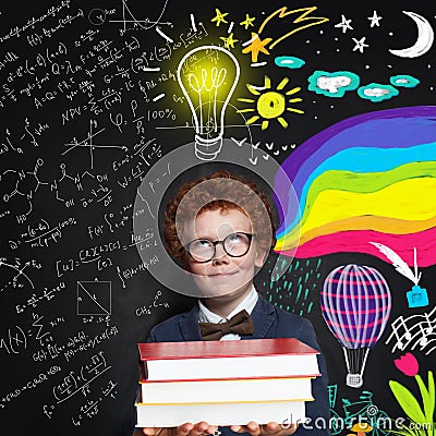 Child boy 9 years old looking at lightbulb, science and arts scetch background. Brainstorming, idea and choice Stock Photo