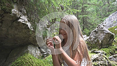 Child in Camping Kid on Mountain Trail, School Girl Relaxing in Forest Adventure Stock Photo