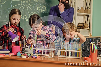 Child care and development. School classes. Kids adorable friends having fun in school. School chemistry lab concept Stock Photo