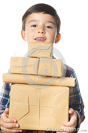 Child carrying Christmas gifts Stock Photo