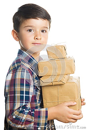 Child carrying Christmas gifts Stock Photo