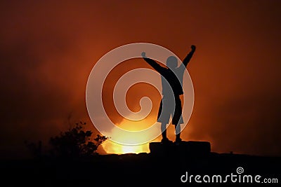 Child celebrates achievement of reaching the crater rim of KÄ«lauea overlook at Volcanoes National Park, Hawaii Big Island. Stock Photo