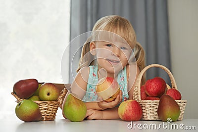 Child choosing a fresh apple to eat Stock Photo
