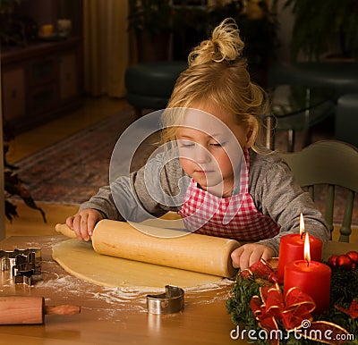 A child at Christmas in Advent when baking cookies Stock Photo