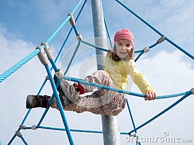 Child on climbing frame Stock Photo