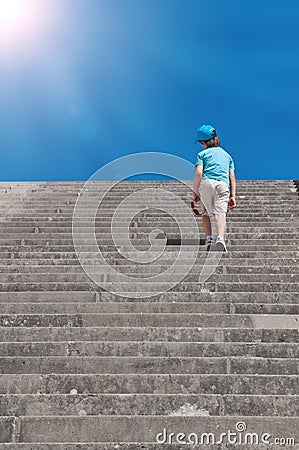 Child climbing stairs Stock Photo