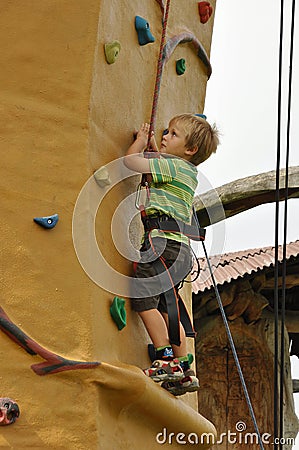 Child climbing wall Stock Photo