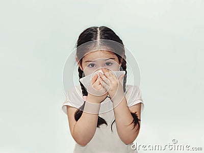 Child cold flu illness tissue blowing runny nose Stock Photo
