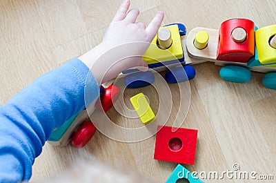 Child`s hand with a toy Stock Photo