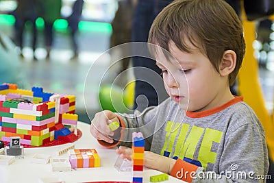 The child collects the Designer. Kids activity in kindergarten or at home Stock Photo