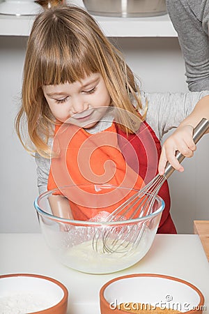 Child cooking whipping yogurt Stock Photo