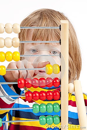 Child Counting on Colorful Wooden Abacus Stock Photo