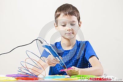 Child creating with 3d printing pen Stock Photo