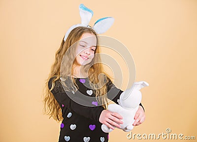 Child cute bunny costume. Kid hold tender soft rabbit toy. Easter day coming. Celebrate easter. Happy childhood. Easter Stock Photo