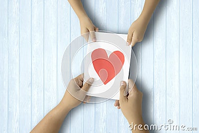 Child and dad hold greeting card Stock Photo