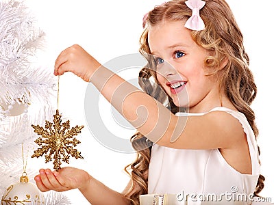 Child decorate Christmas tree. Stock Photo